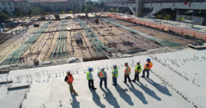 Construction workers surveying a site